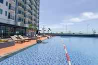 Swimming Pool Tranquil Stay and Simply 2BR at Osaka Riverview PIK 2 Apartment By Travelio