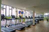 Fitness Center Elegant and Warm 1BR Apartment at Gold Coast By Travelio