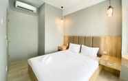 Bedroom 2 Comfort and Simply Look 1BR Vasanta Innopark Apartment By Travelio