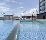 Swimming Pool 5 Tidy Studio and Modern Look (No Kitchen) Osaka Riverview PIK 2 Apartment By Travelio