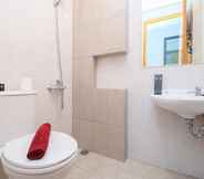 In-room Bathroom 6 Modern and Comfort 2BR at Royal Heights Apartment By Travelio