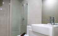 In-room Bathroom 6 Comfort and Clean 2BR at Daan Mogot City Apartment By Travelio