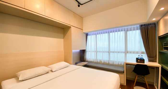 Kamar Tidur Tidy and Pleasant Studio Apartment Springlake Summarecon Bekasi By Travelio