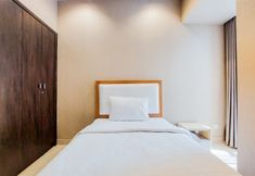 Bedroom 2 Comfortable and Scenic 2BR Branz BSD City Apartment By Travelio