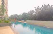 Swimming Pool 5 Relaxing and Cozy Studio at Transpark Cibubur Apartment By Travelio