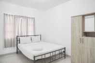 Bedroom Cozy and Best Deal 2BR Puri Garden Apartment By Travelio