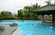 Swimming Pool 6 Cozy and Best Deal 2BR Puri Garden Apartment By Travelio