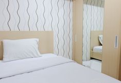 Kamar Tidur 2 Cozy and Homey 2BR Apartment at Tamansari La Grande By Travelio