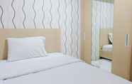 Bedroom 2 Cozy and Homey 2BR Apartment at Tamansari La Grande By Travelio