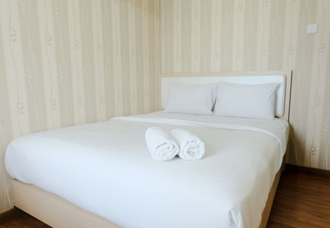 Kamar Tidur Cozy and Homey 2BR Apartment at Tamansari La Grande By Travelio