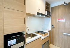 Common Space 5 Simply Look and Warm Studio Tamansari Iswara Apartment By Travelio