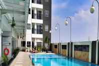 Swimming Pool Cozy and Homey 2BR at Mekarwangi Square Cibaduyut Apartment By Travelio