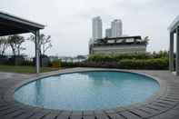 Swimming Pool Comfy and Exclusive Studio Kemang Mansion Apartment By Travelio