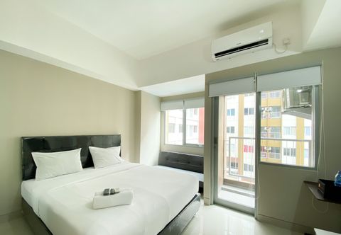 Bedroom Cozy and Homey Stay Studio LRT City Jatibening Apartment By Travelio