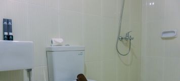 In-room Bathroom 5 Spacious and Modern Look 1BR at Neo Soho Apartment By Travelio