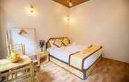 Phòng ngủ 3 Hang Mua Village Homestay