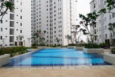 Swimming Pool Simply and Strategic Designed 2BR at Bassura City Apartment By Travelio