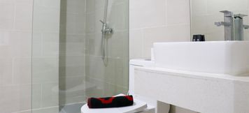 In-room Bathroom 5 Comfort Living and Homey 2BR at Daan Mogot City Apartment By Travelio