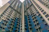 Bangunan Cozy Stay and Simple 1BR at Evenciio Margonda Apartment By Travelio