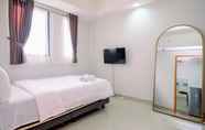 Bedroom 2 Cozy Stay and Simple 1BR at Evenciio Margonda Apartment By Travelio