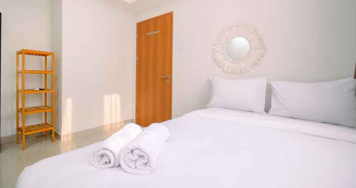 Bedroom Cozy Stay and Simple 1BR at Evenciio Margonda Apartment By Travelio