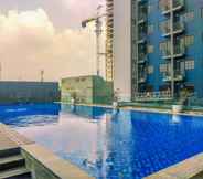 Kolam Renang 6 Cozy Stay and Simple 1BR at Evenciio Margonda Apartment By Travelio