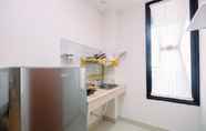 Common Space 4 Cozy Stay and Simple 1BR at Evenciio Margonda Apartment By Travelio