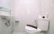 In-room Bathroom 5 Cozy Stay and Simple 1BR at Evenciio Margonda Apartment By Travelio