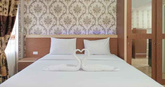 Kamar Tidur Comfort and Minimalist Studio Podomoro City Deli Medan Apartment By Travelio