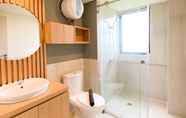 In-room Bathroom 7 Warm and Comfort Living 3BR at Meikarta Apartment By Travelio