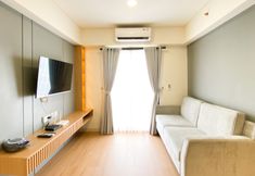 Common Space 4 Warm and Comfort Living 3BR at Meikarta Apartment By Travelio