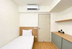 Bedroom 2 Warm and Comfort Living 3BR at Meikarta Apartment By Travelio