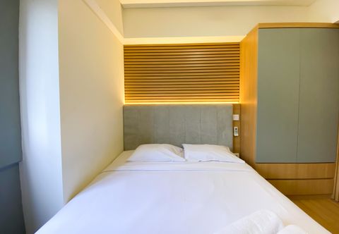 Bedroom Warm and Comfort Living 3BR at Meikarta Apartment By Travelio