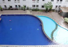 Kolam Renang 4 Enjoy and Cozy Studio Room at Green Pramuka City Apartment By Travelio