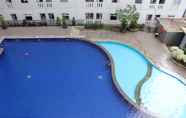 Swimming Pool 4 Enjoy and Cozy Studio Room at Green Pramuka City Apartment By Travelio