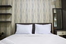 Bedroom Enjoy and Cozy Studio Room at Green Pramuka City Apartment By Travelio