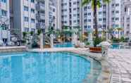 Swimming Pool 5 Stay Cozy 1BR at Sky Terrace Apartment By Travelio