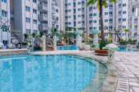 Swimming Pool Stay Cozy 1BR at Sky Terrace Apartment By Travelio
