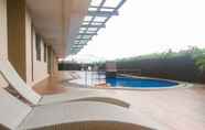 Swimming Pool 6 Nice and Comfort 2BR at Belmont Residence Puri Apartment By Travelio