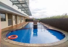 Swimming Pool 7 Nice and Comfort 2BR at Belmont Residence Puri Apartment By Travelio