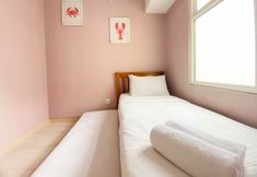 Bedroom 3 Elegant and Comfort 4BR Combined at Springlake Summarecon Bekasi Apartment By Travelio