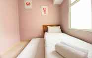 Bedroom 3 Elegant and Comfort 4BR Combined at Springlake Summarecon Bekasi Apartment By Travelio