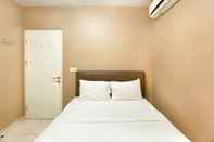 Bedroom Elegant and Comfort 4BR Combined at Springlake Summarecon Bekasi Apartment By Travelio