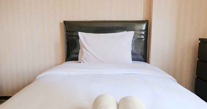 Bedroom Cozy and Homey Studio Room at Suites @Metro Apartment By Travelio