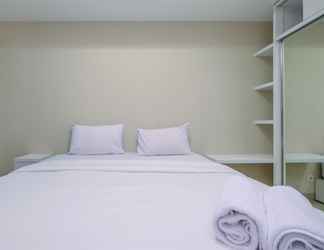 Kamar Tidur 2 Tidy and Modern 1BR Apartment at Nine Residence By Travelio