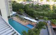 Swimming Pool 5 Homey and Wonderful 1BR Ciputra International Apartment By Travelio
