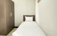 Bedroom 2 Homey 2BR Crown Court Executive Condominium Apartment By Travelio