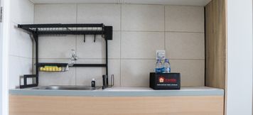 Common Space 2 Minimalist and Tranquil Studio at Osaka Riverview PIK 2 Apartment By Travelio