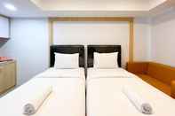 Bedroom Cozy and Homey Studio at De Prima Apartment By Travelio
