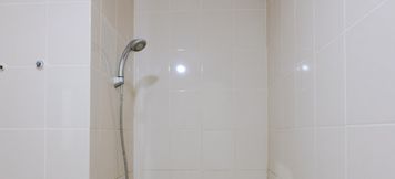 In-room Bathroom 5 2BR Homey Apartment at Parahyangan Residence By Travelio